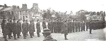 Order after chaos: Parade before the wreckage of Market Street
